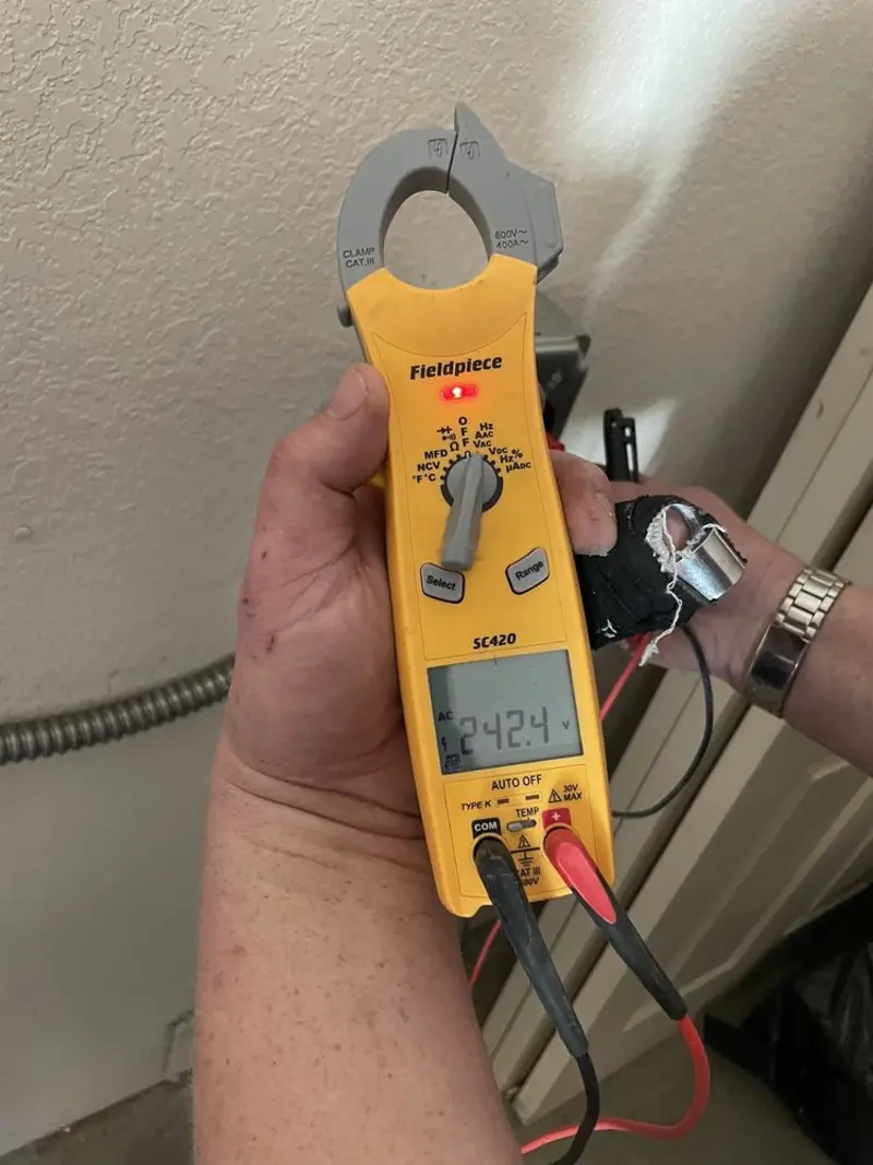 Voltage testing with clamp meter during Electrical Installation Services in McRae-Helena